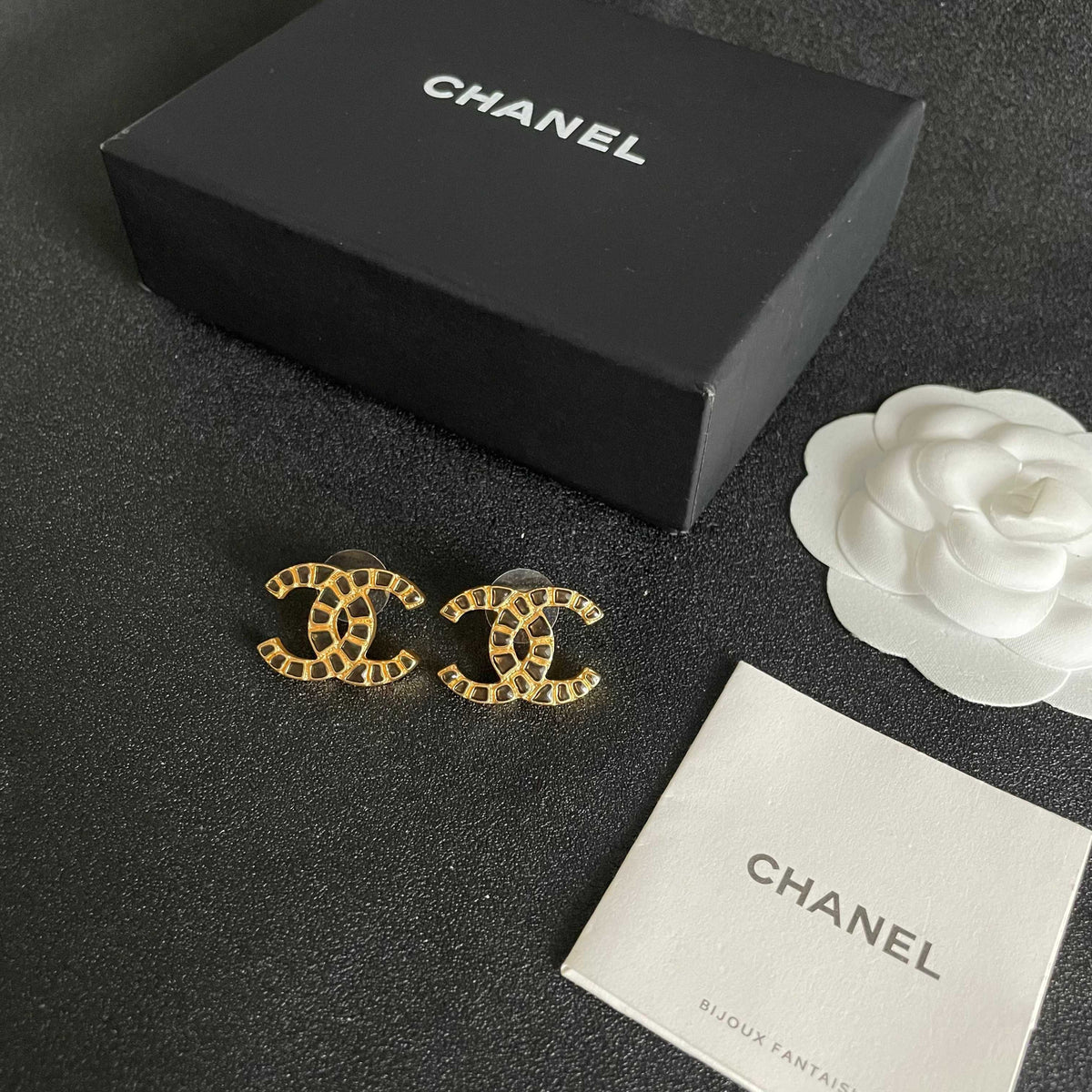 Martin Graham stud earrings in polished metal-tone – close-up detail