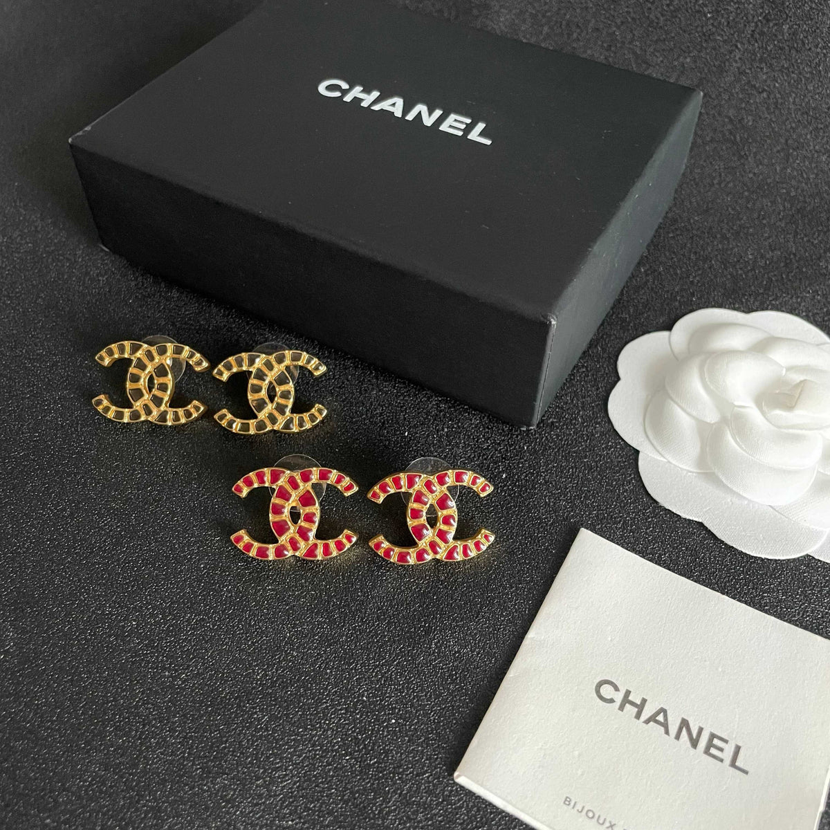 Martin Graham stud earrings in polished metal-tone – close-up detail