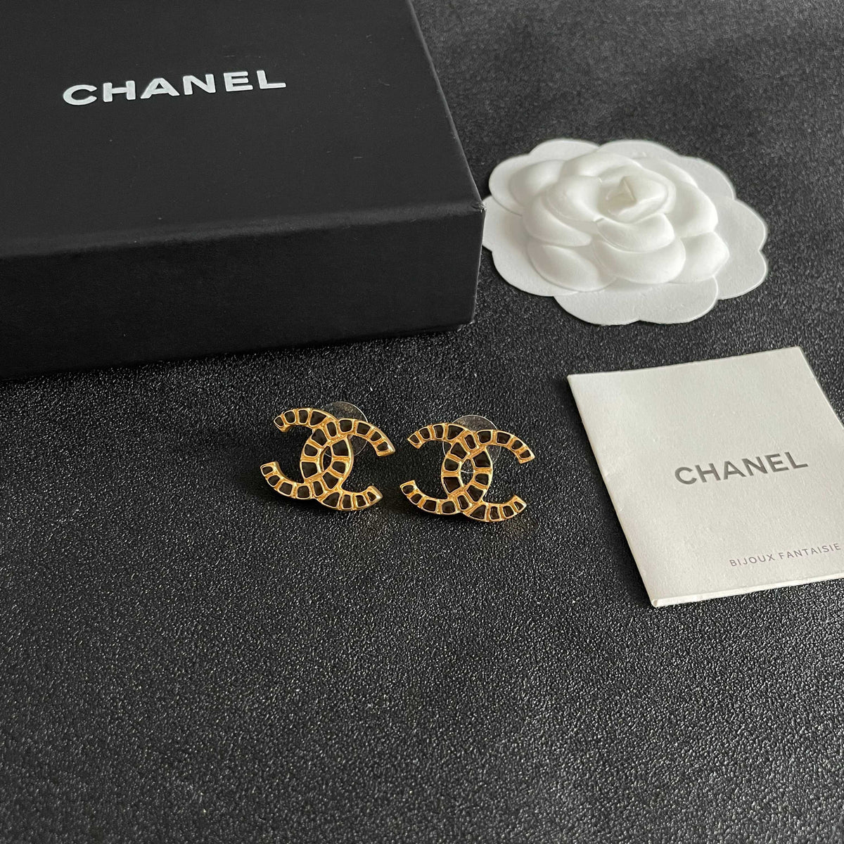 Martin Graham stud earrings in polished metal-tone – styled product view