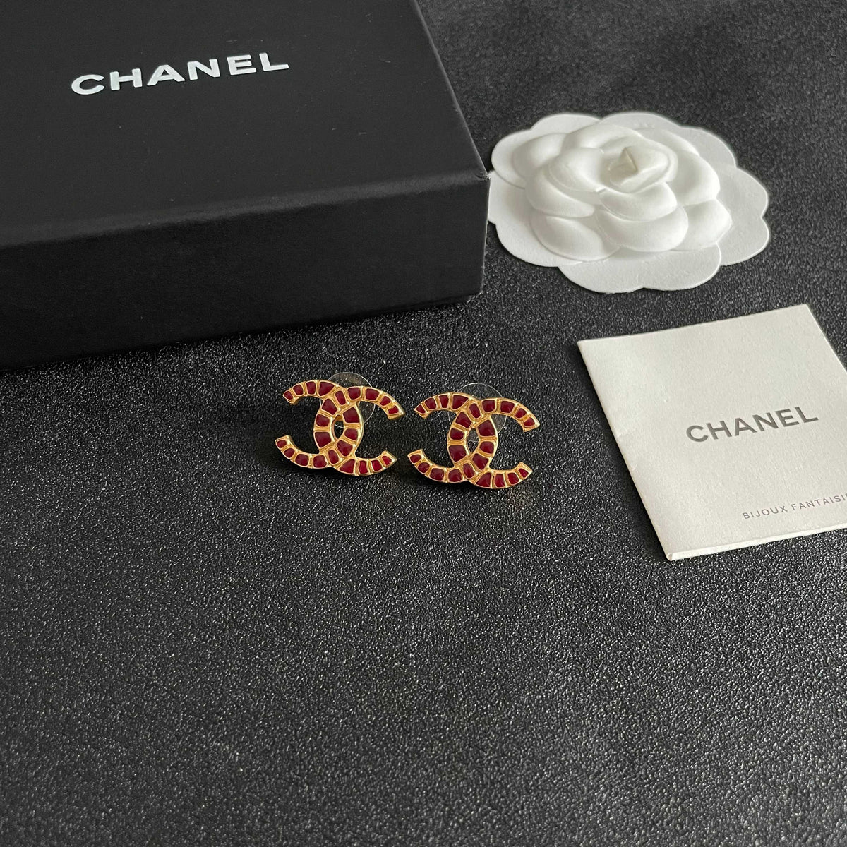 Martin Graham stud earrings in polished metal-tone – styled product view