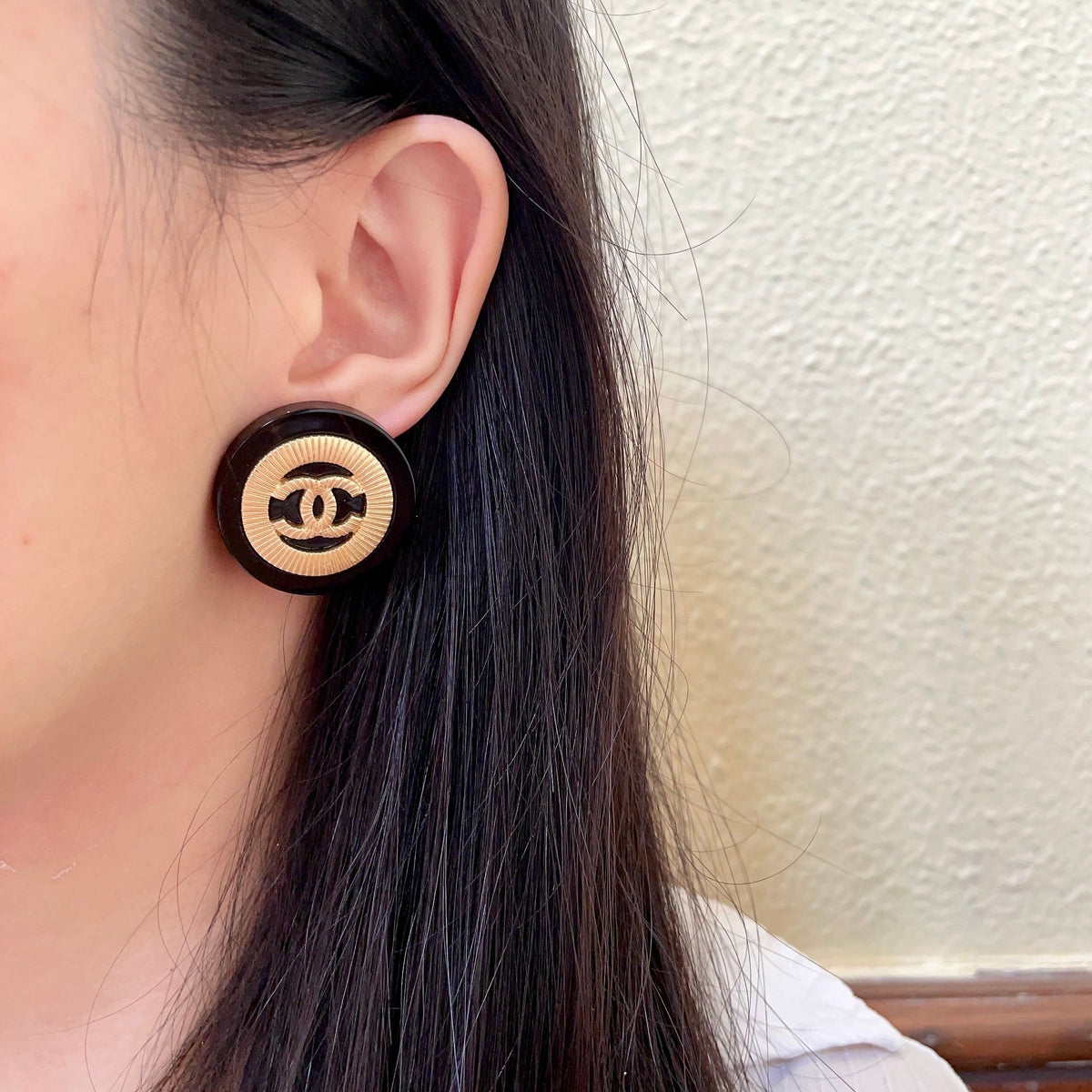 Martin Graham stud earrings in polished metal-tone – detail view