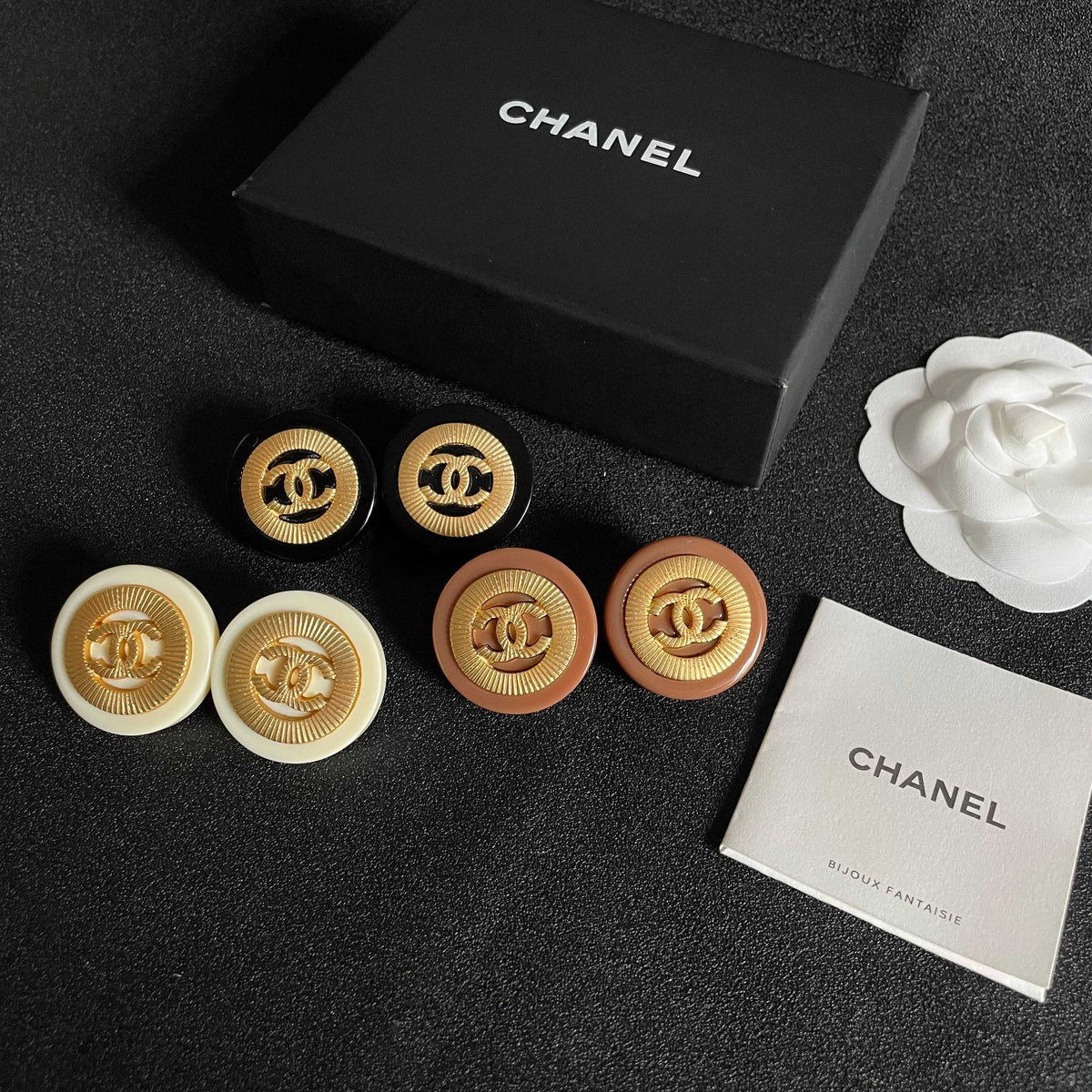 Martin Graham stud earrings in polished metal-tone – close-up detail