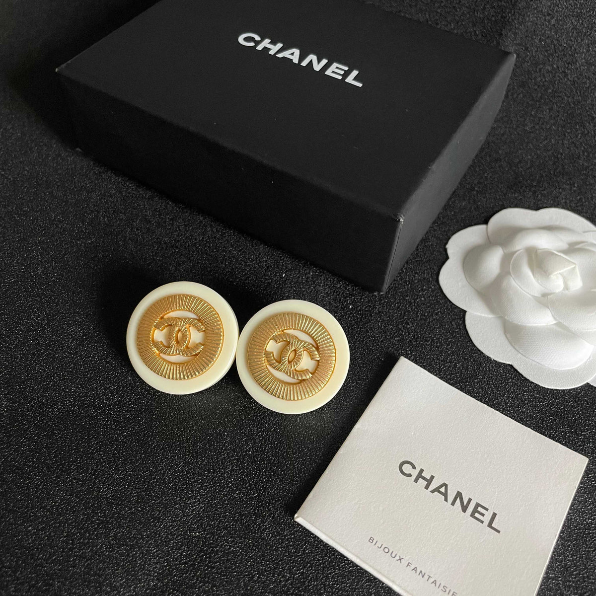 Martin Graham stud earrings in polished metal-tone – close-up detail