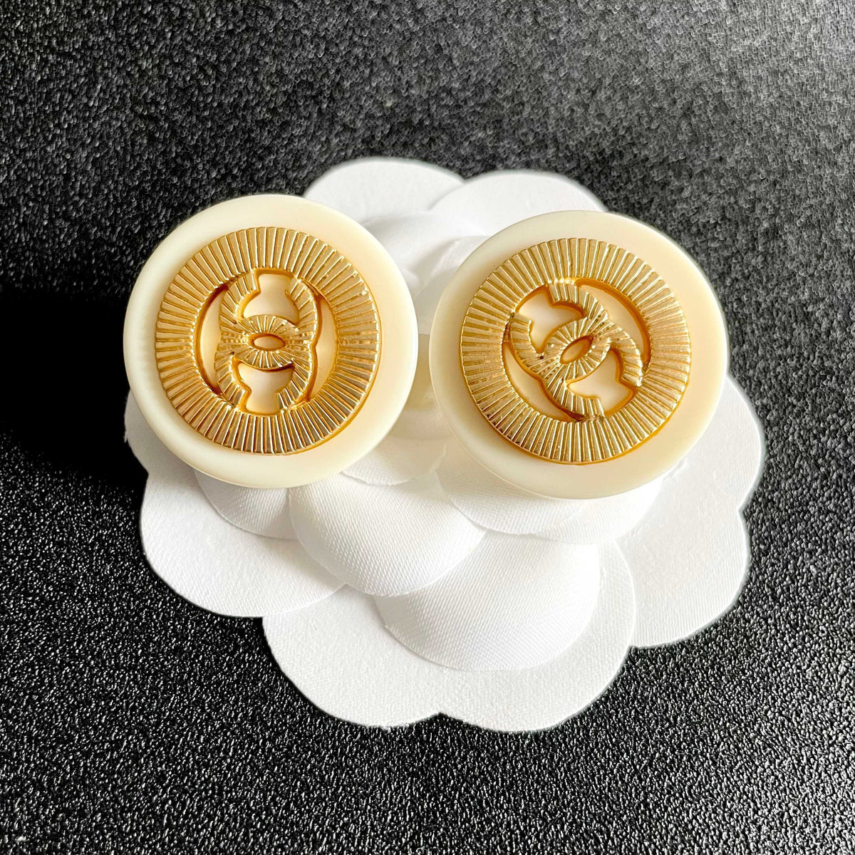 Martin Graham stud earrings in polished metal-tone – front product view