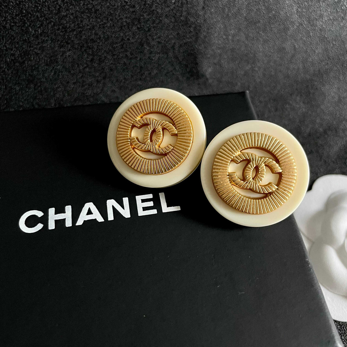 Martin Graham stud earrings in polished metal-tone – detail view