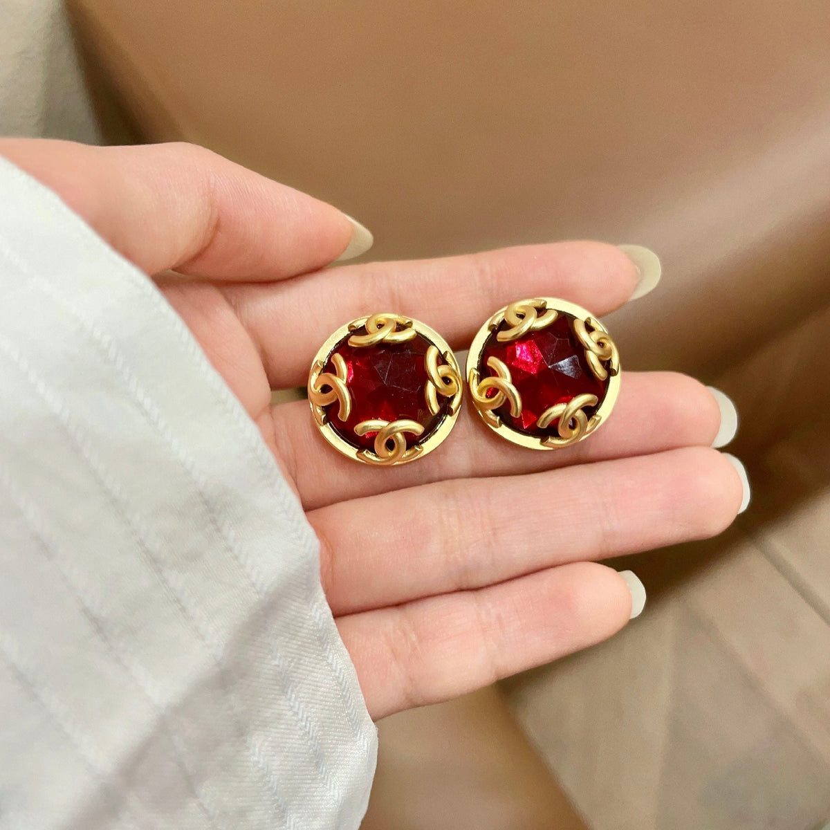 Martin Graham stud earrings in polished metal-tone – side detail