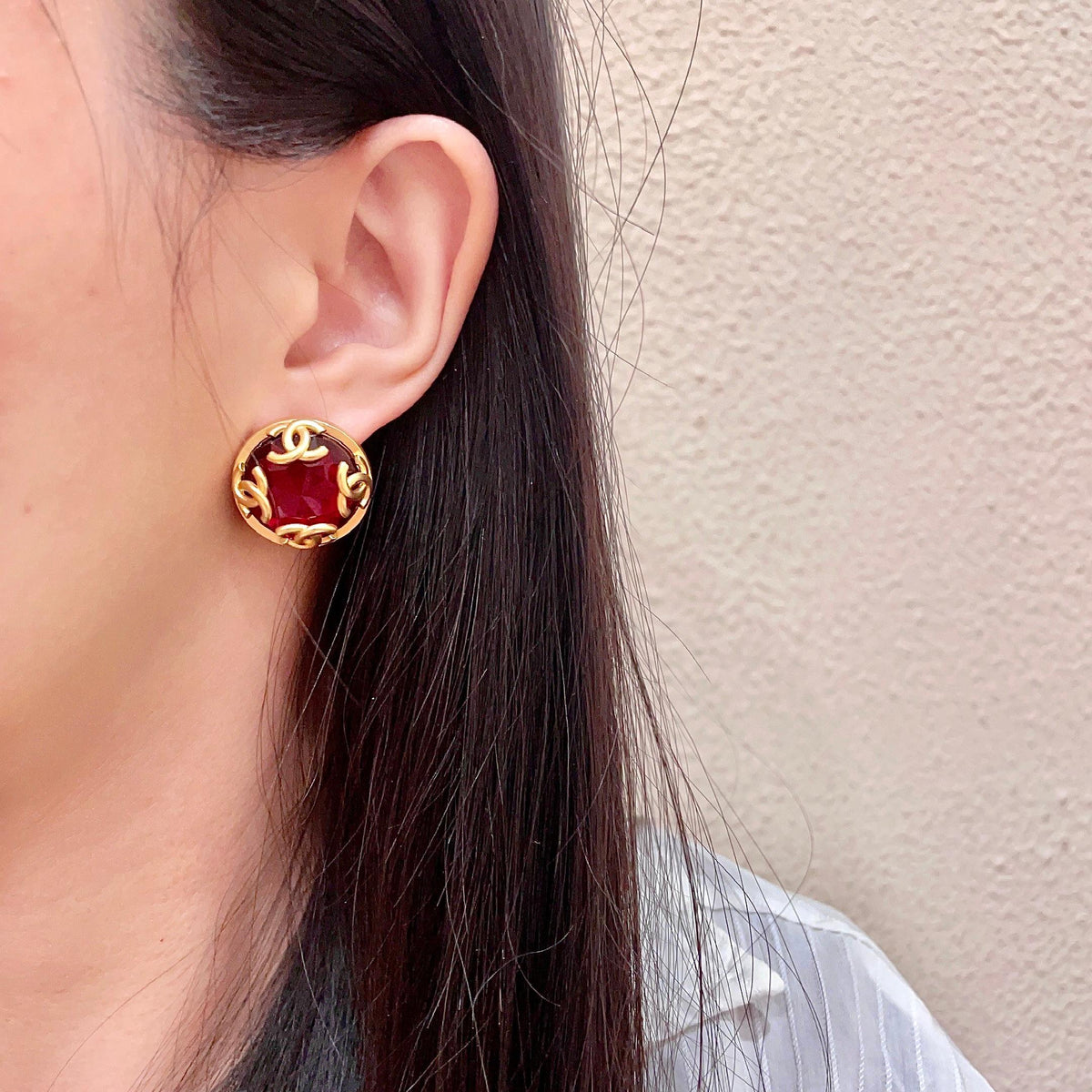 Martin Graham stud earrings in polished metal-tone – detail view