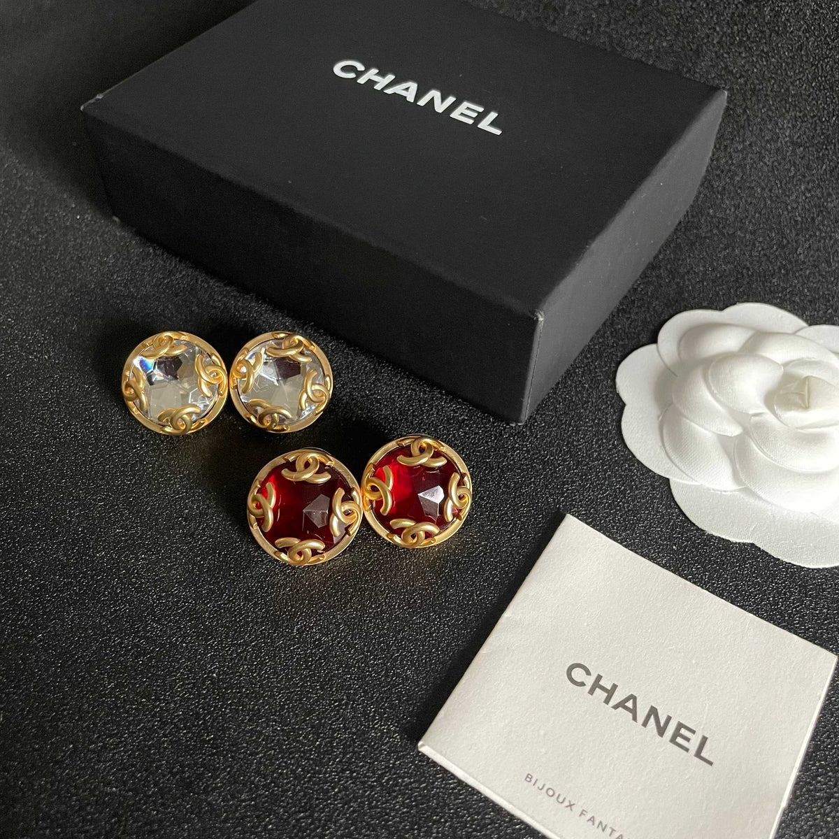 Martin Graham stud earrings in polished metal-tone – close-up detail