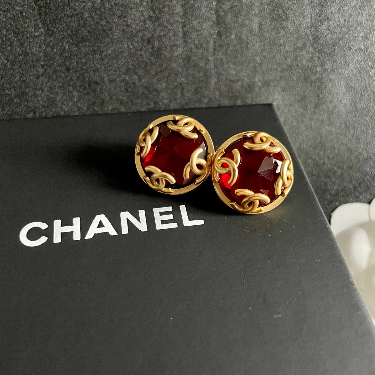 Martin Graham stud earrings in polished metal-tone – detail view