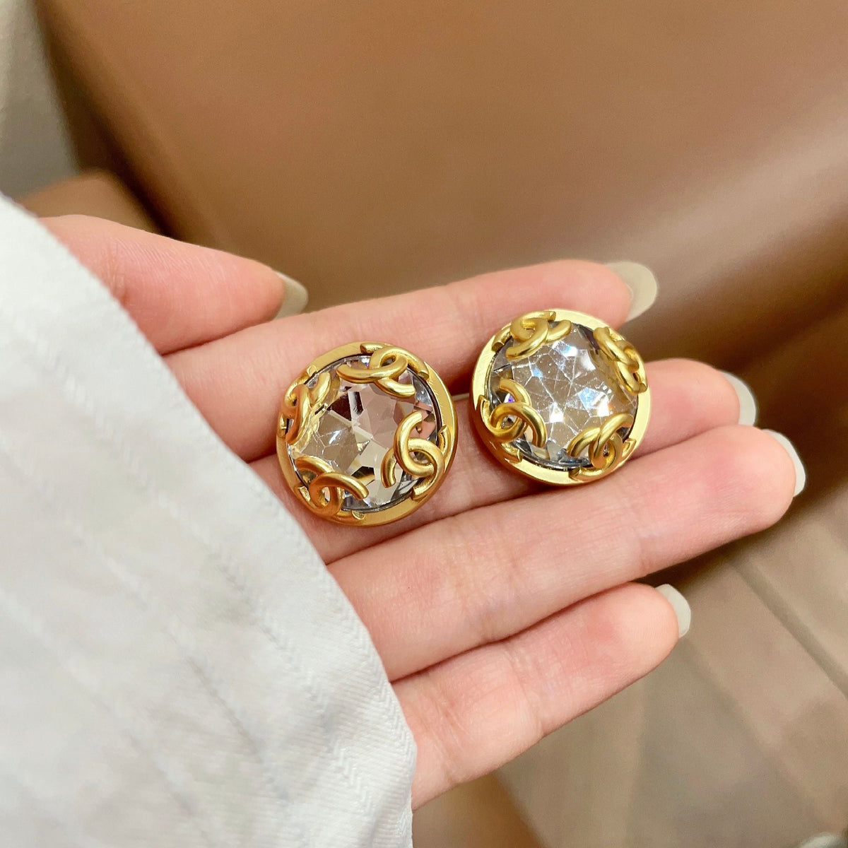 Martin Graham stud earrings in polished metal-tone – side detail