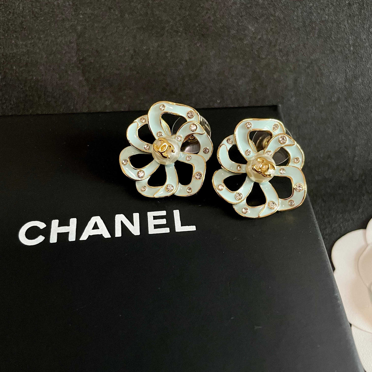 Martin Graham stud earrings in polished metal-tone – detail view