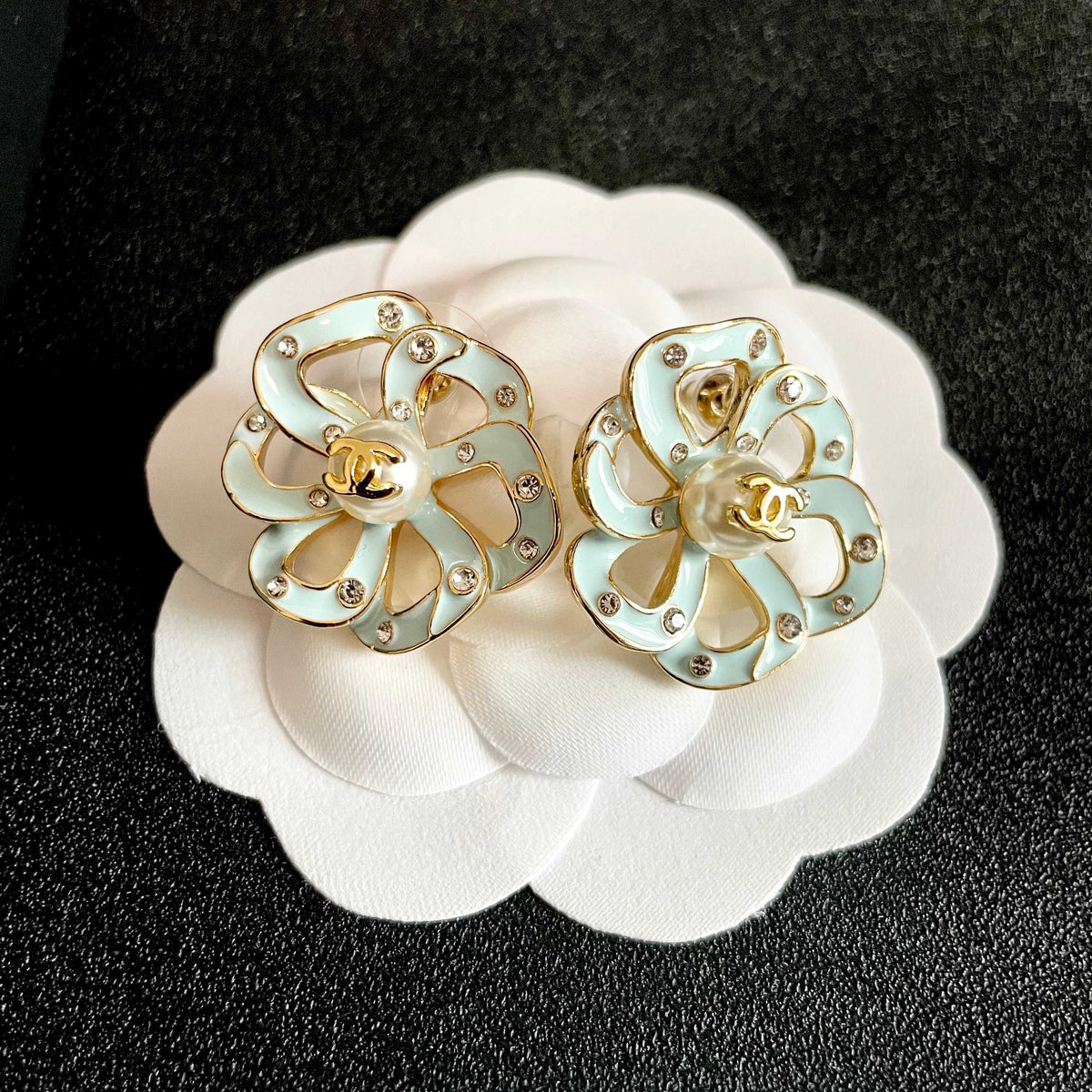 Martin Graham stud earrings in polished metal-tone – front product view