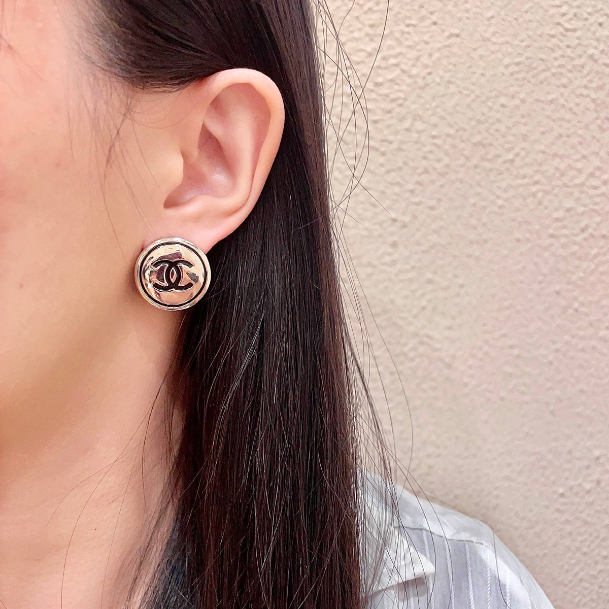 Martin Graham stud earrings in polished metal-tone – detail view