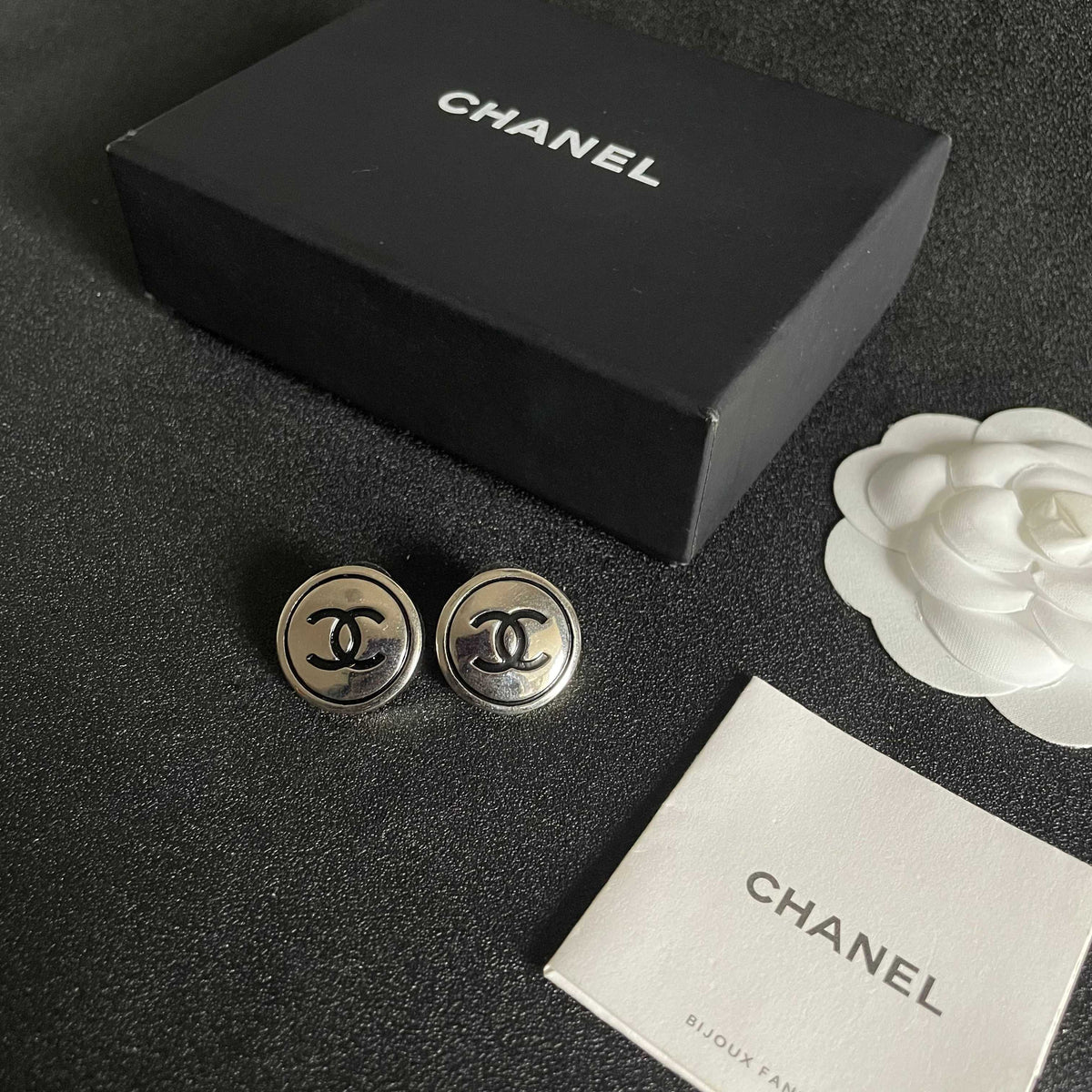 Martin Graham stud earrings in polished metal-tone – close-up detail