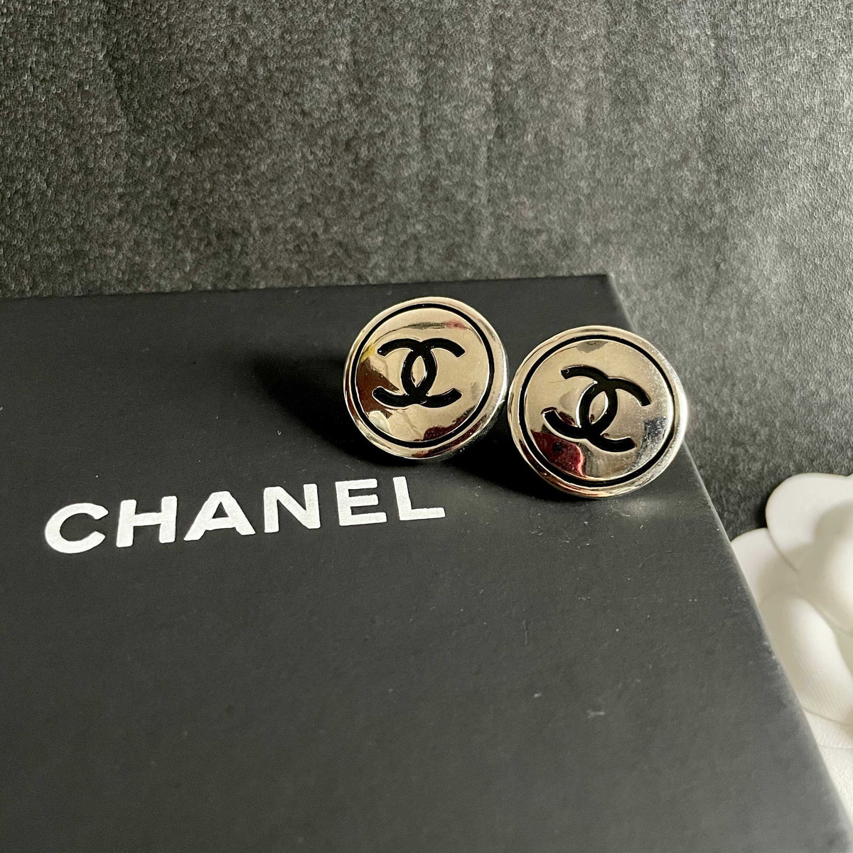 Martin Graham stud earrings in polished metal-tone – detail view