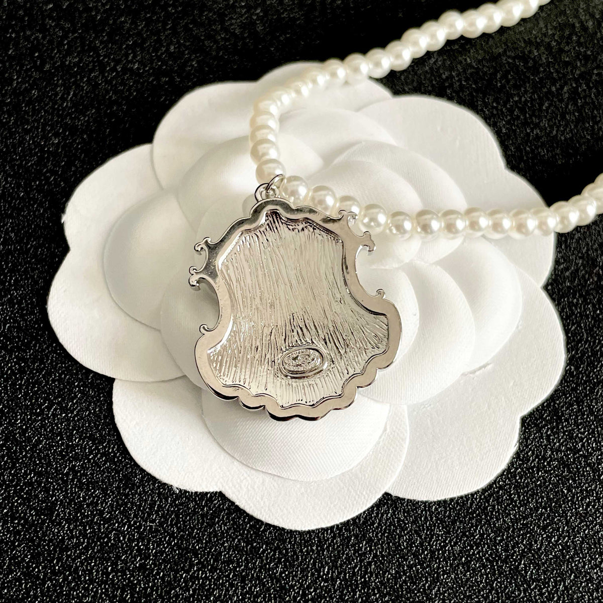Martin Graham pendant necklace in polished metal-tone – front product view