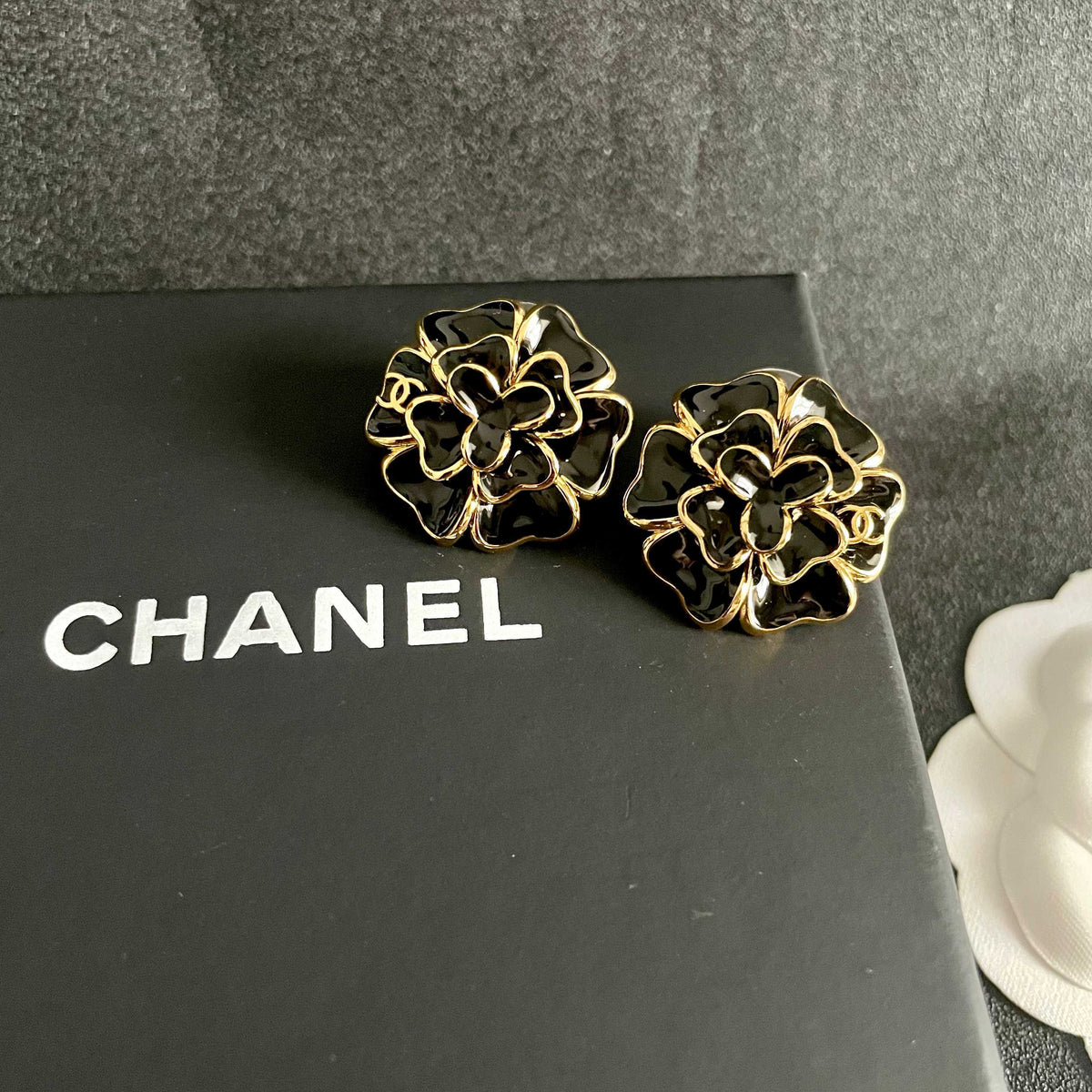 Martin Graham stud earrings in polished metal-tone – detail view