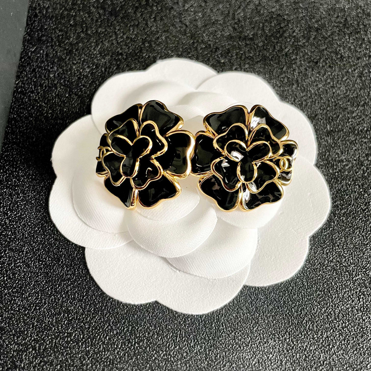 Martin Graham stud earrings in polished metal-tone – front product view