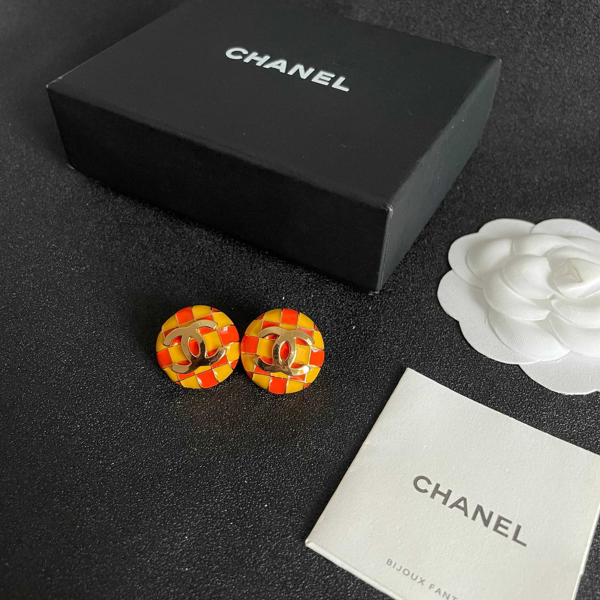 Martin Graham stud earrings in polished metal-tone – close-up detail