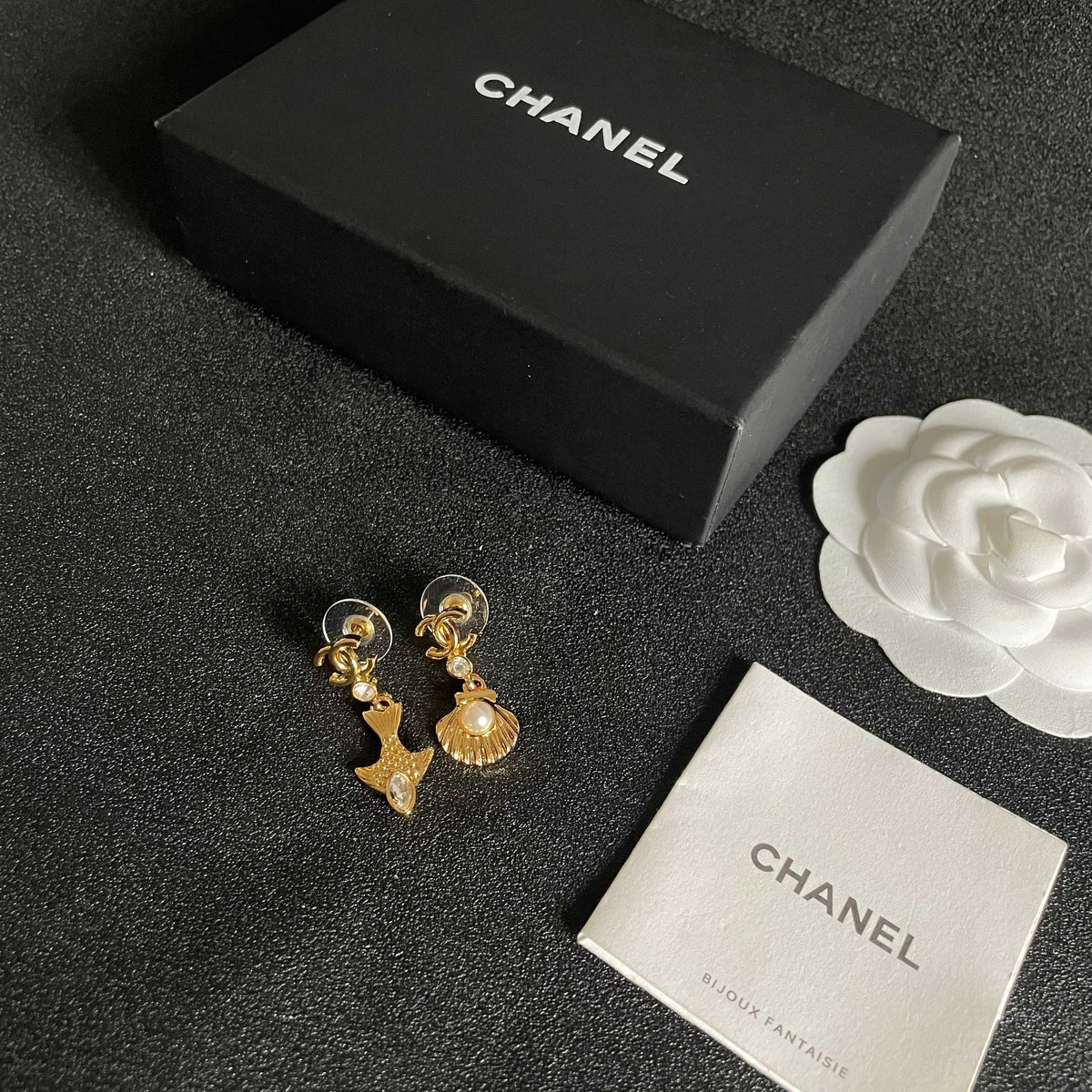 Martin Graham earrings in polished metal-tone – close-up detail