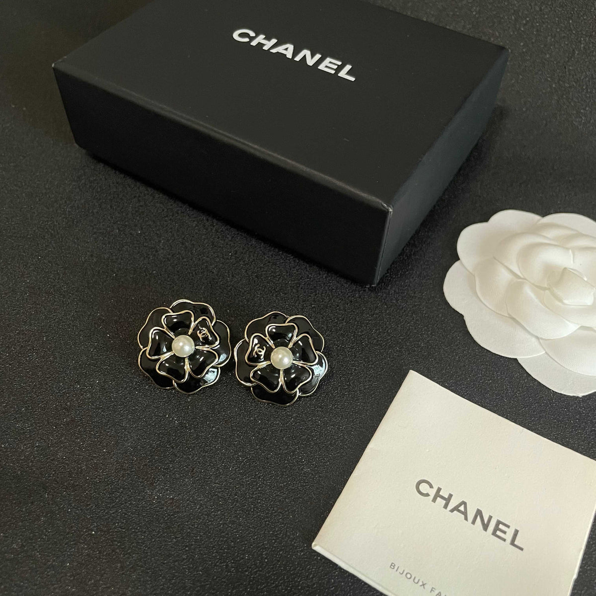 Martin Graham stud earrings in polished metal-tone – close-up detail