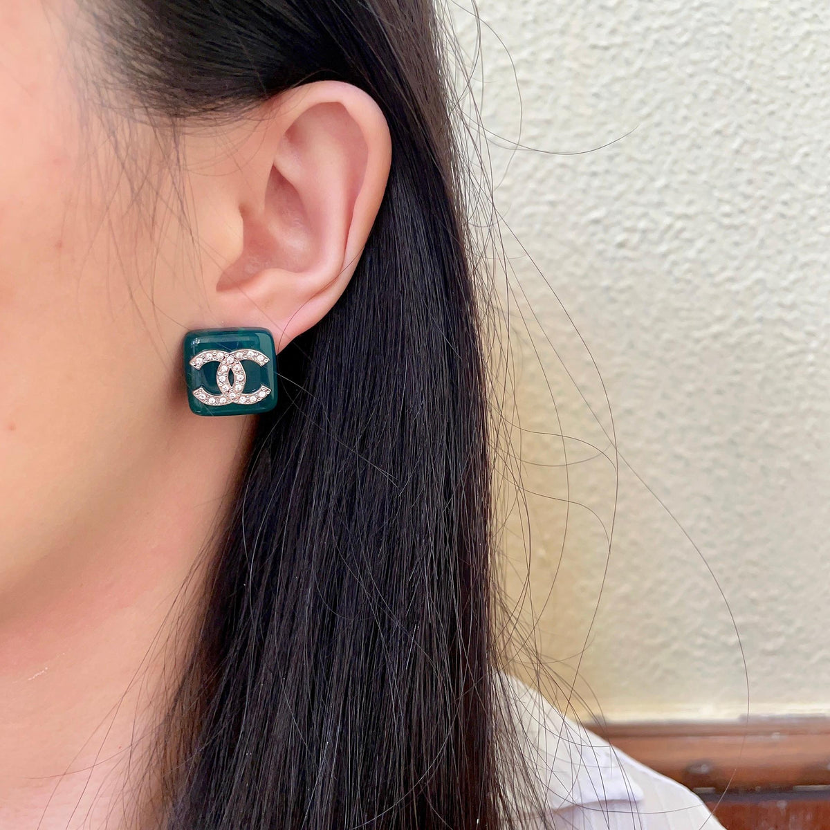 Martin Graham stud earrings in polished metal-tone – detail view