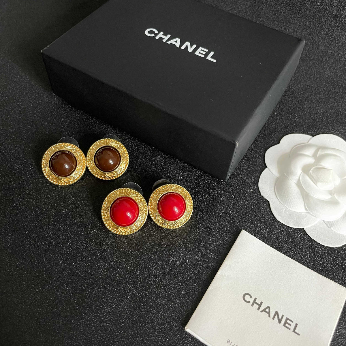 Martin Graham stud earrings in polished metal-tone – close-up detail