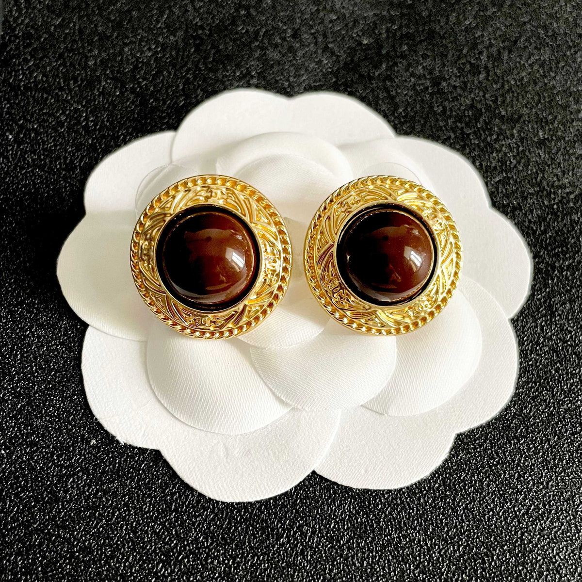 Martin Graham stud earrings in polished metal-tone – front product view