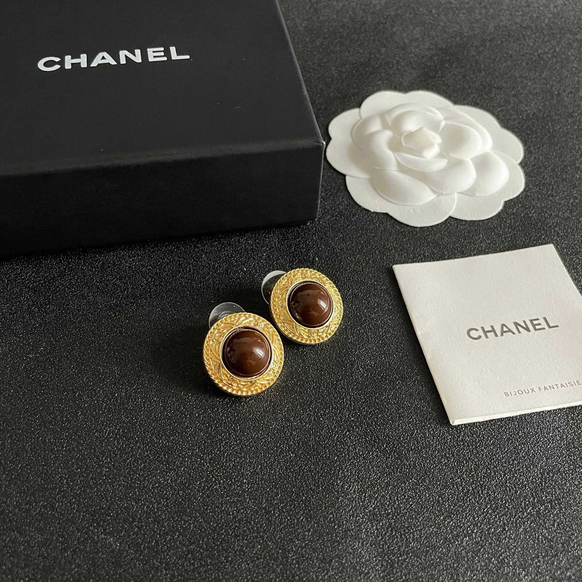 Martin Graham stud earrings in polished metal-tone – styled product view