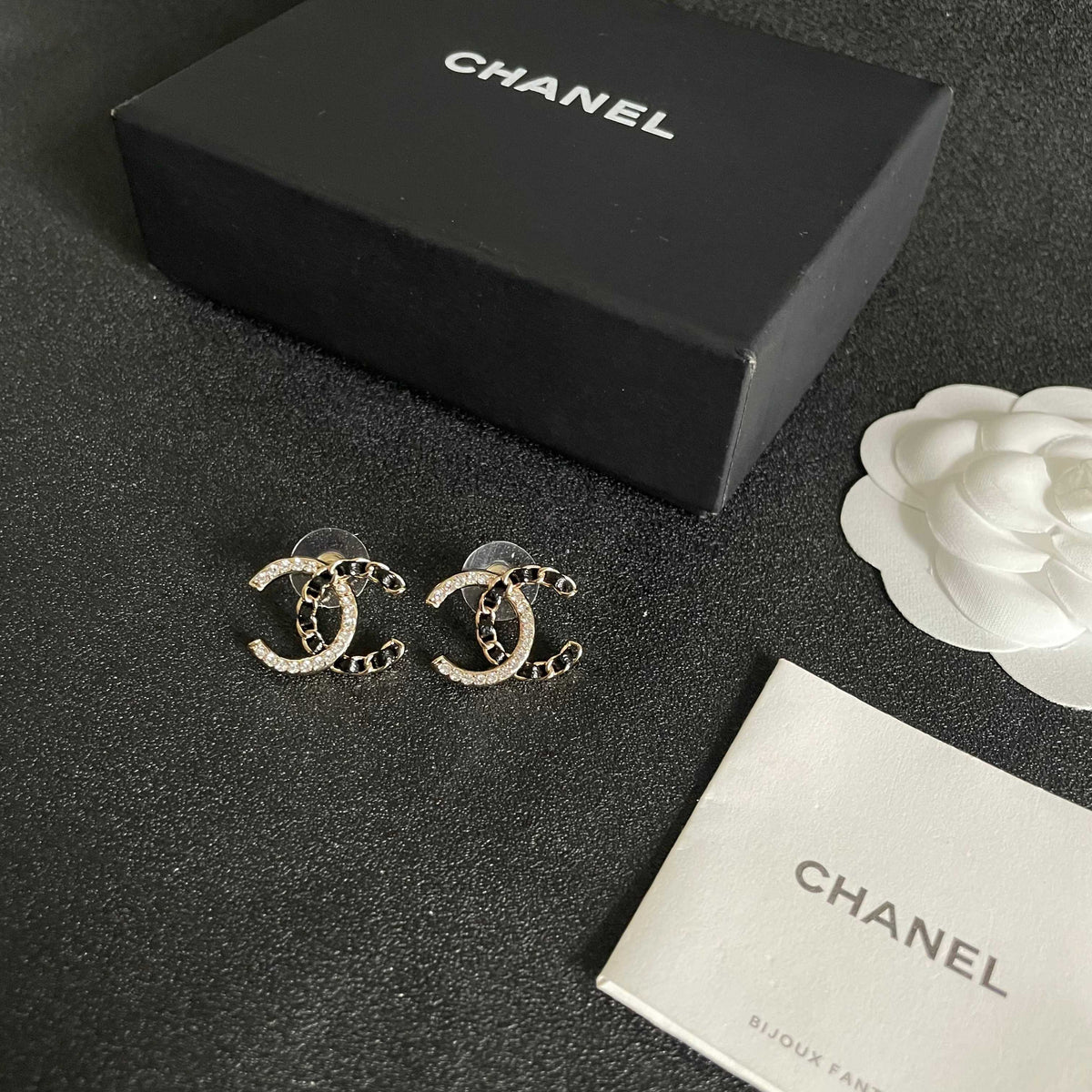 Martin Graham stud earrings in polished metal-tone – close-up detail