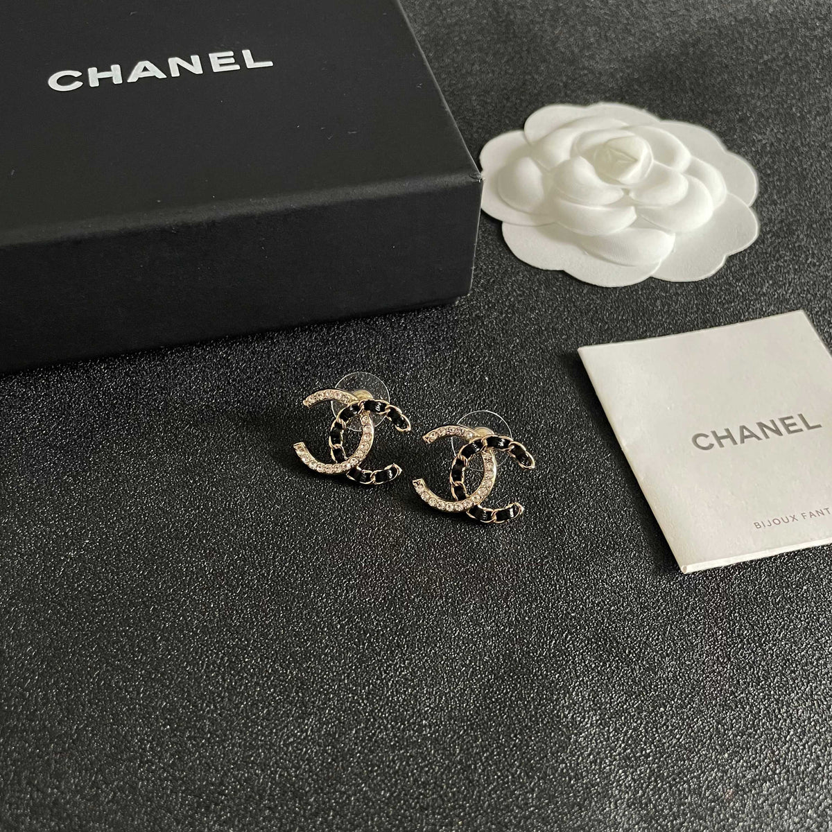 Martin Graham stud earrings in polished metal-tone – styled product view