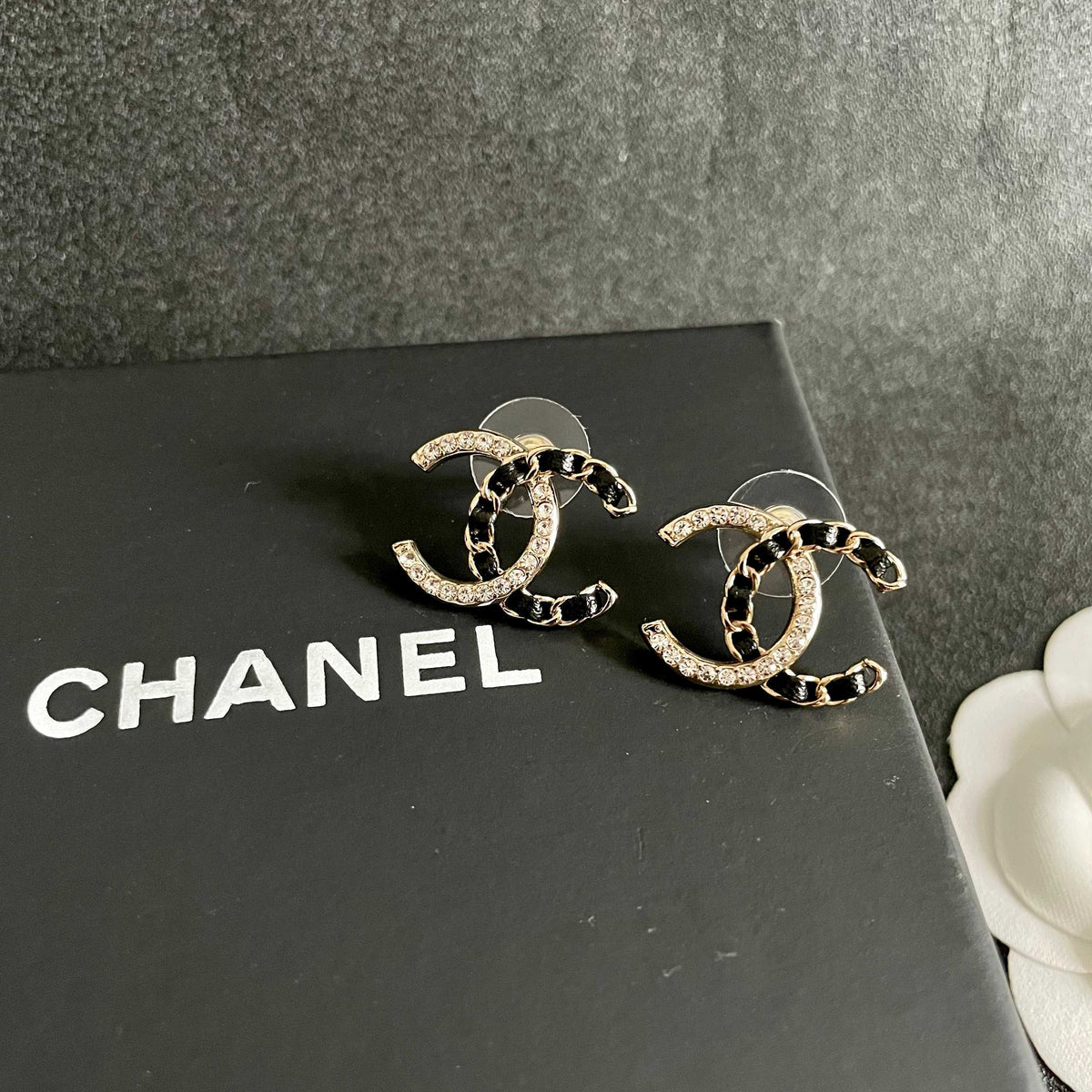 Martin Graham stud earrings in polished metal-tone – detail view