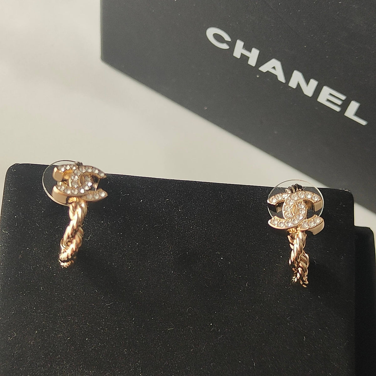 Martin Graham stud earrings in polished metal-tone – detail view