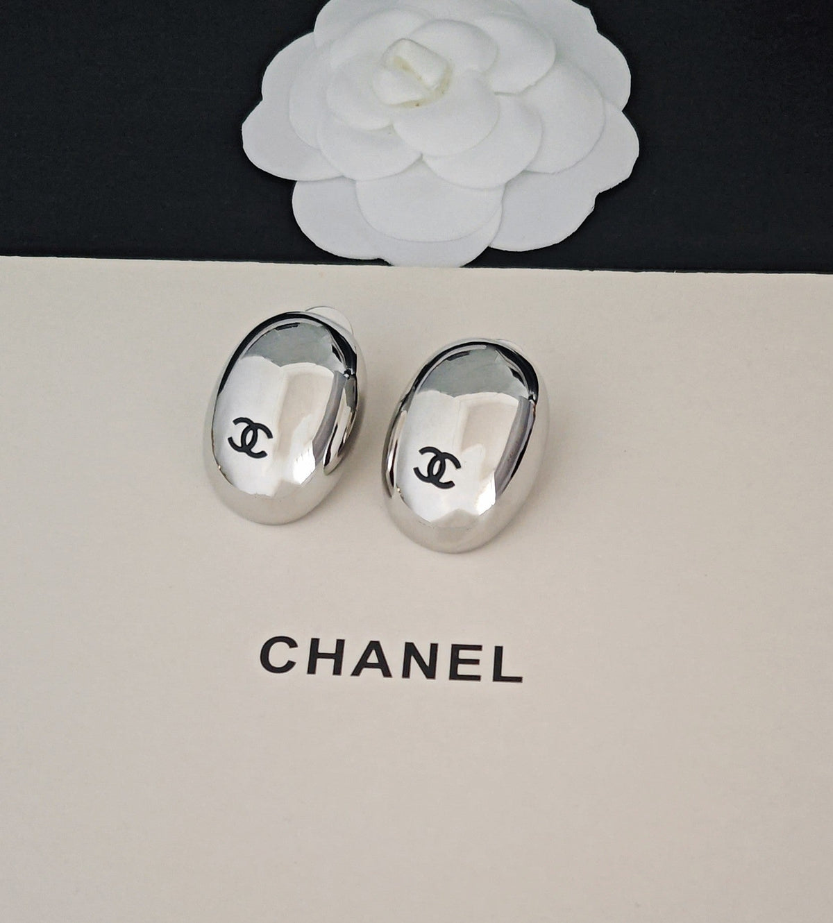 Martin Graham stud earrings in polished metal-tone – styled product view