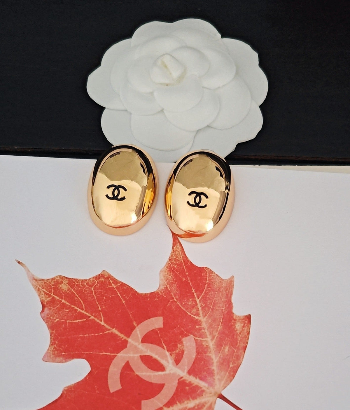 Martin Graham stud earrings in polished metal-tone – close-up detail