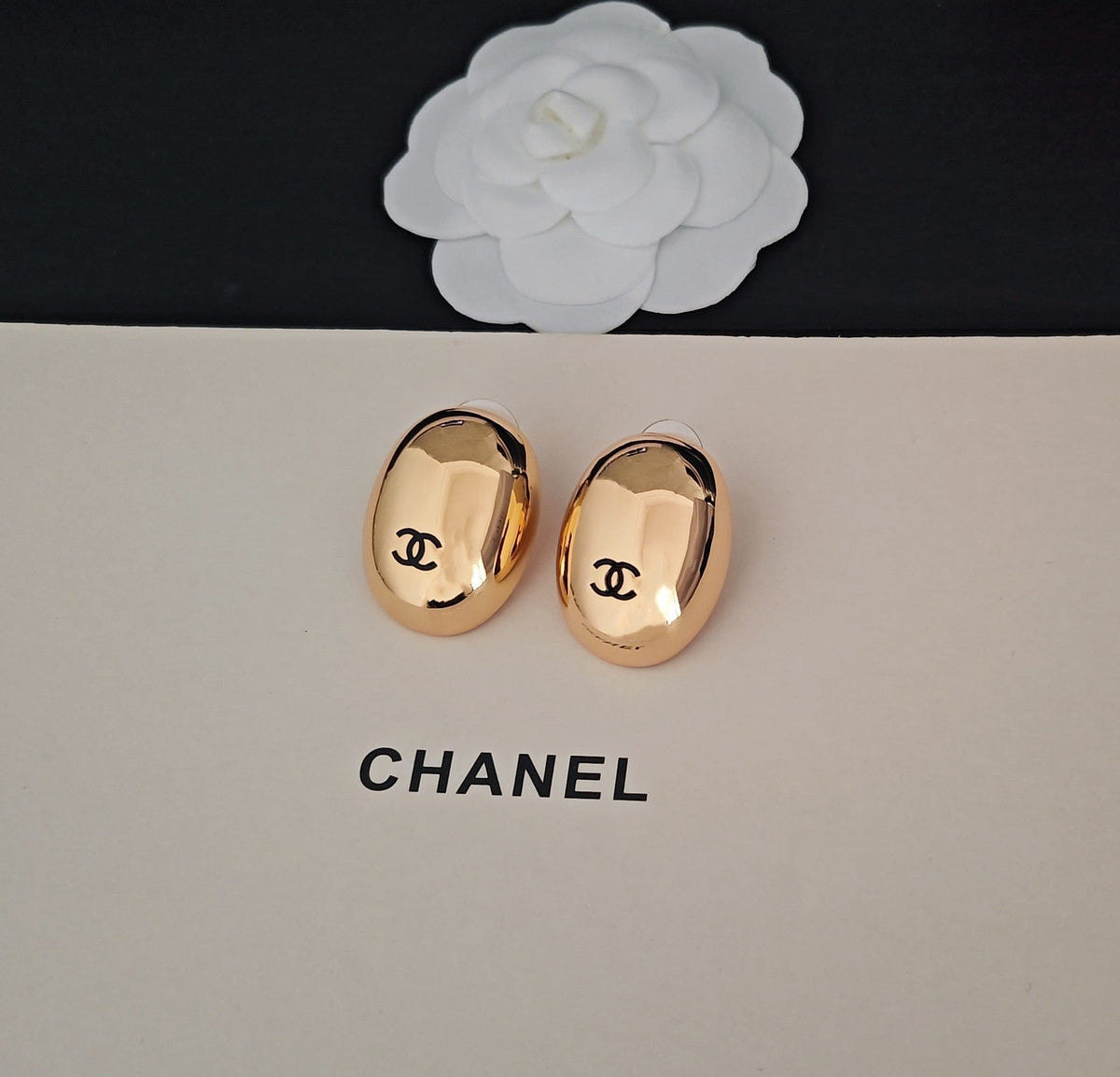Martin Graham stud earrings in polished metal-tone – styled product view