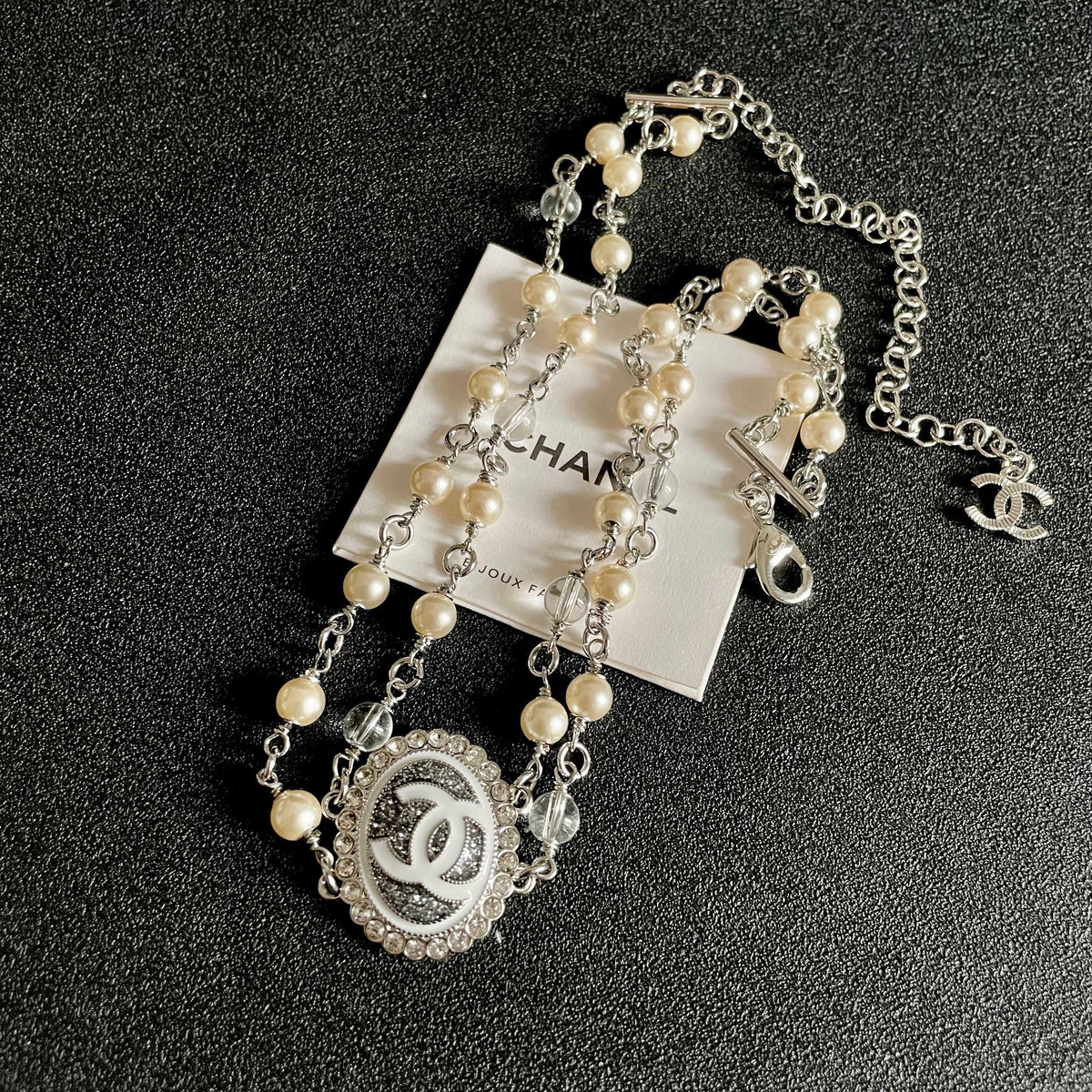 Martin Graham pendant necklace in polished metal-tone – detail view