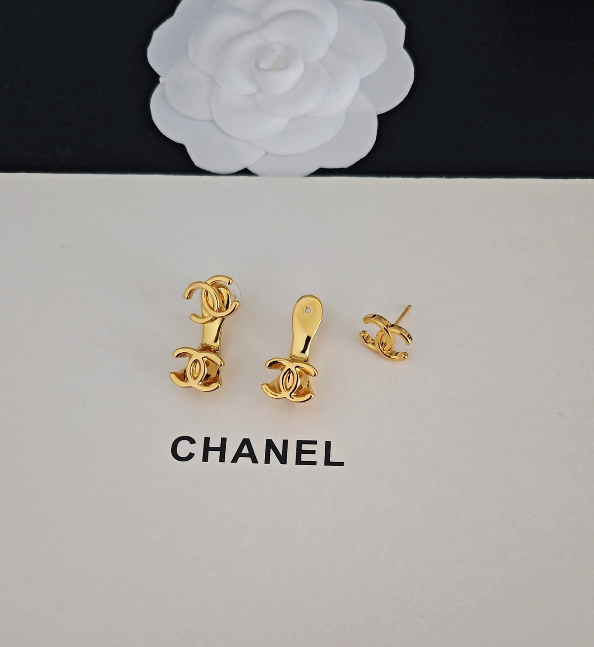 Martin Graham earrings in polished metal-tone – close-up detail