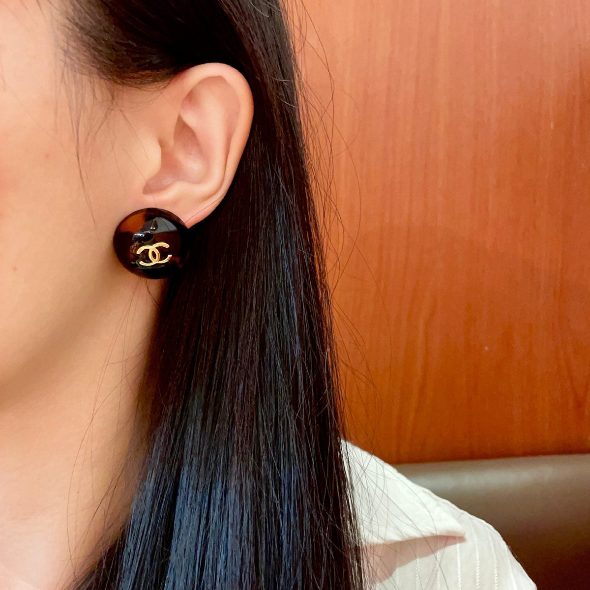 Martin Graham stud earrings in polished metal-tone – detail view
