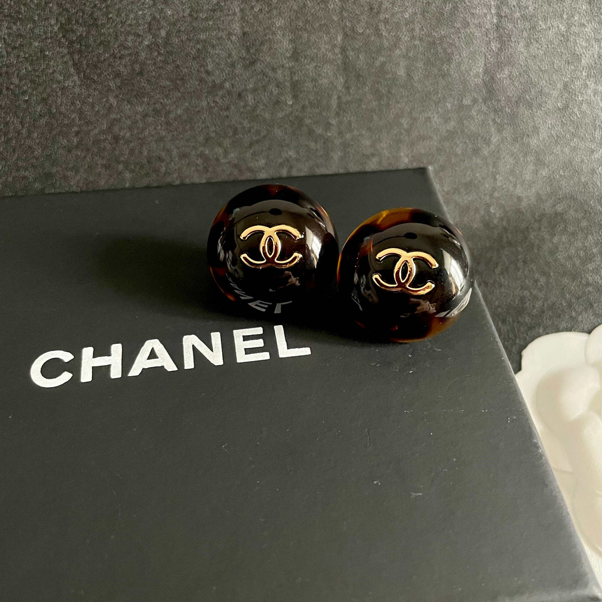 Martin Graham stud earrings in polished metal-tone – detail view