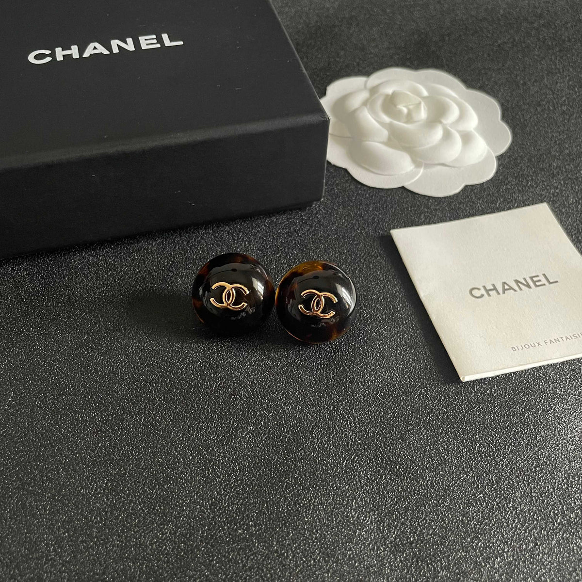 Martin Graham stud earrings in polished metal-tone – styled product view