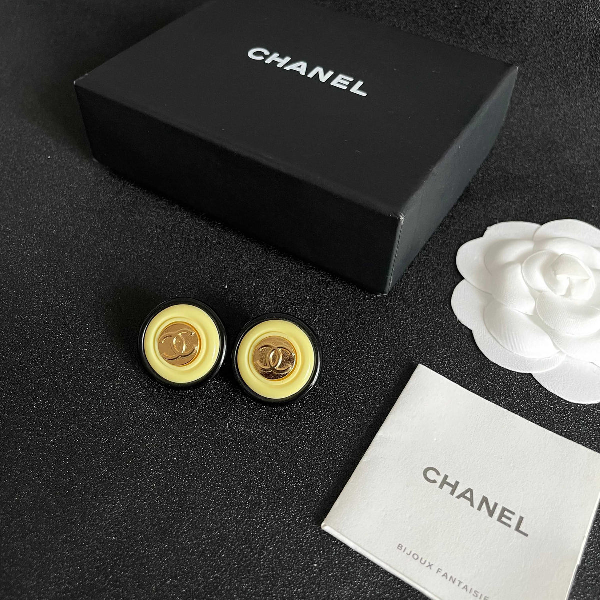 Martin Graham stud earrings in polished metal-tone – close-up detail