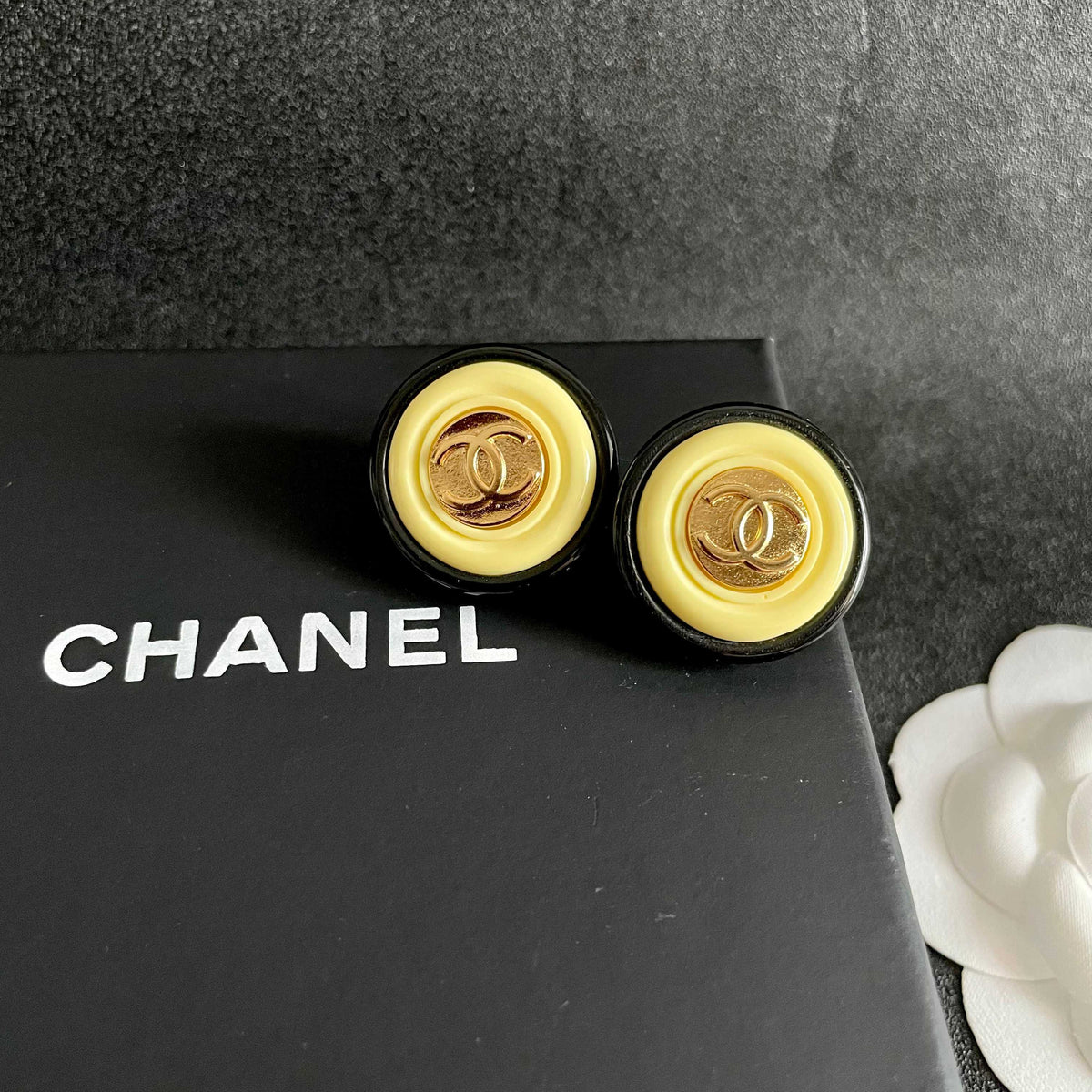 Martin Graham stud earrings in polished metal-tone – detail view