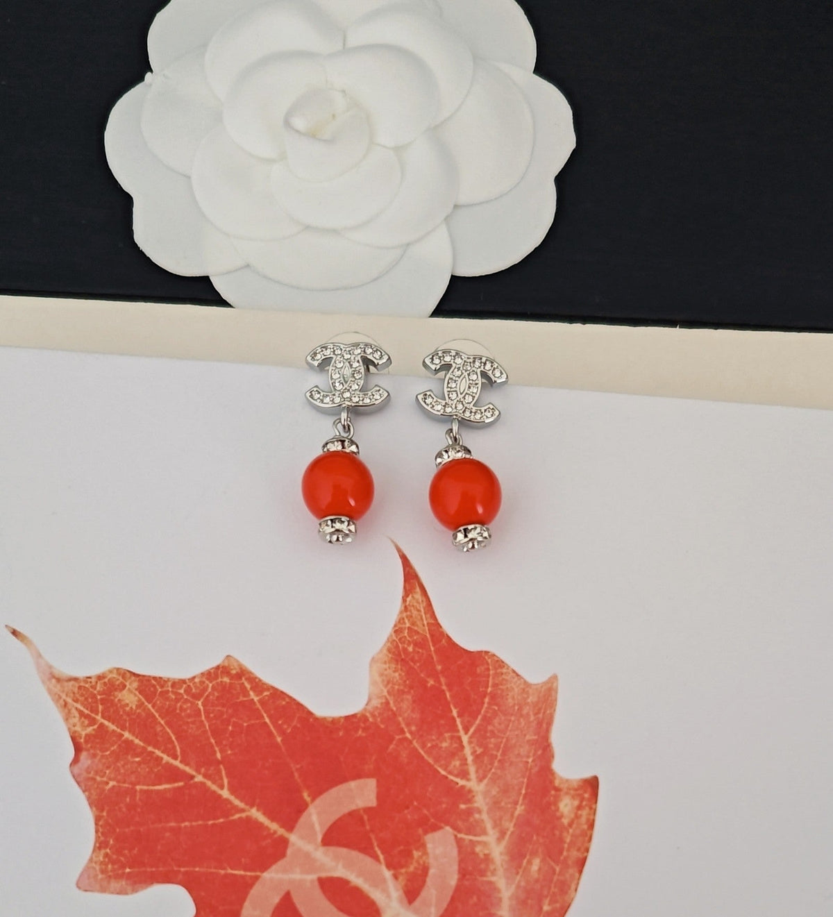 Martin Graham earrings in polished metal-tone – close-up detail