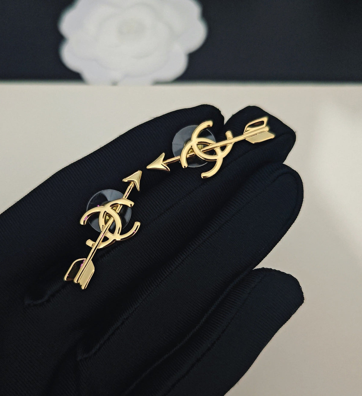 Martin Graham stud earrings in polished metal-tone – detail view