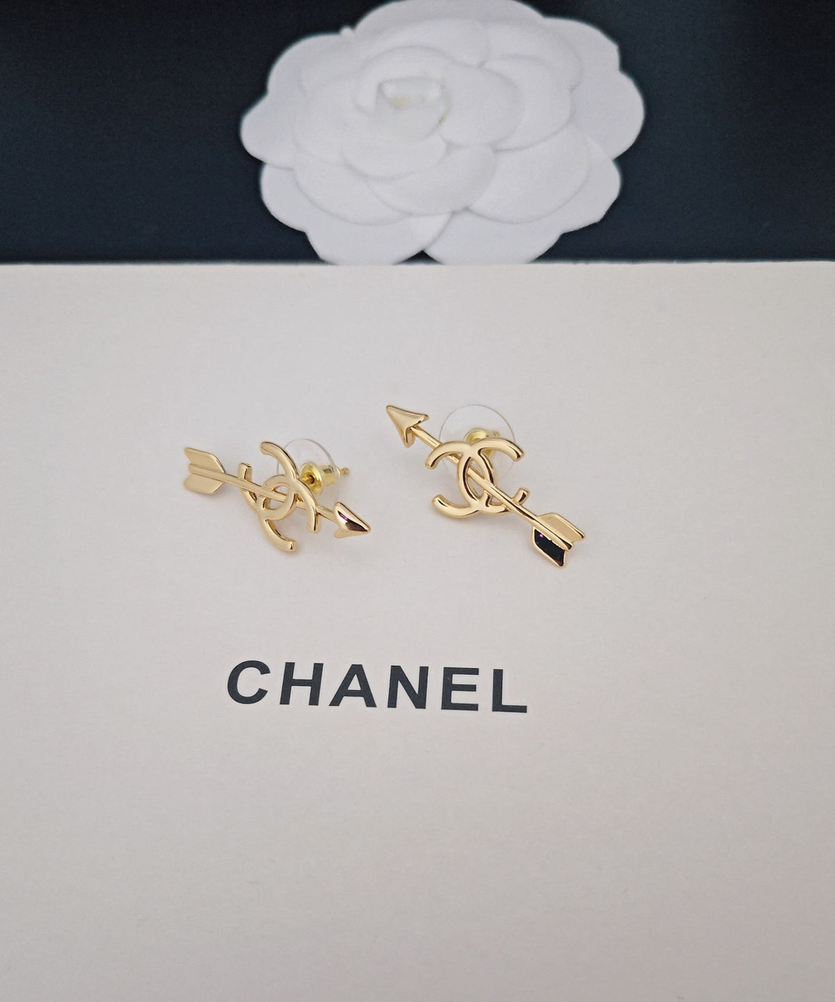 Martin Graham stud earrings in polished metal-tone – side detail
