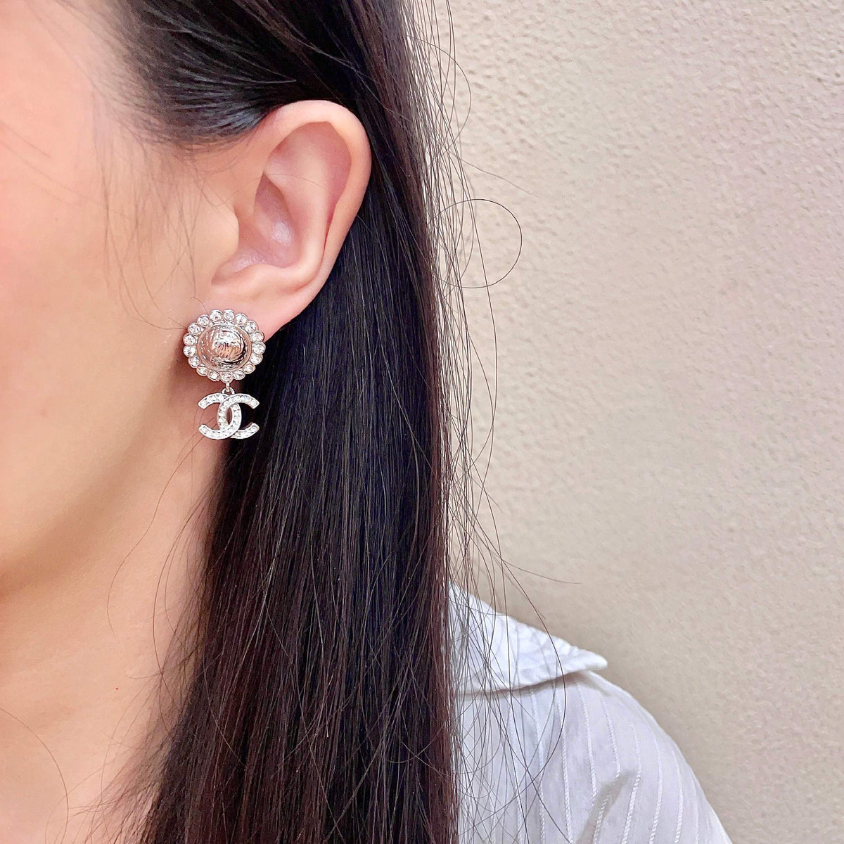 Martin Graham stud earrings in polished metal-tone – detail view