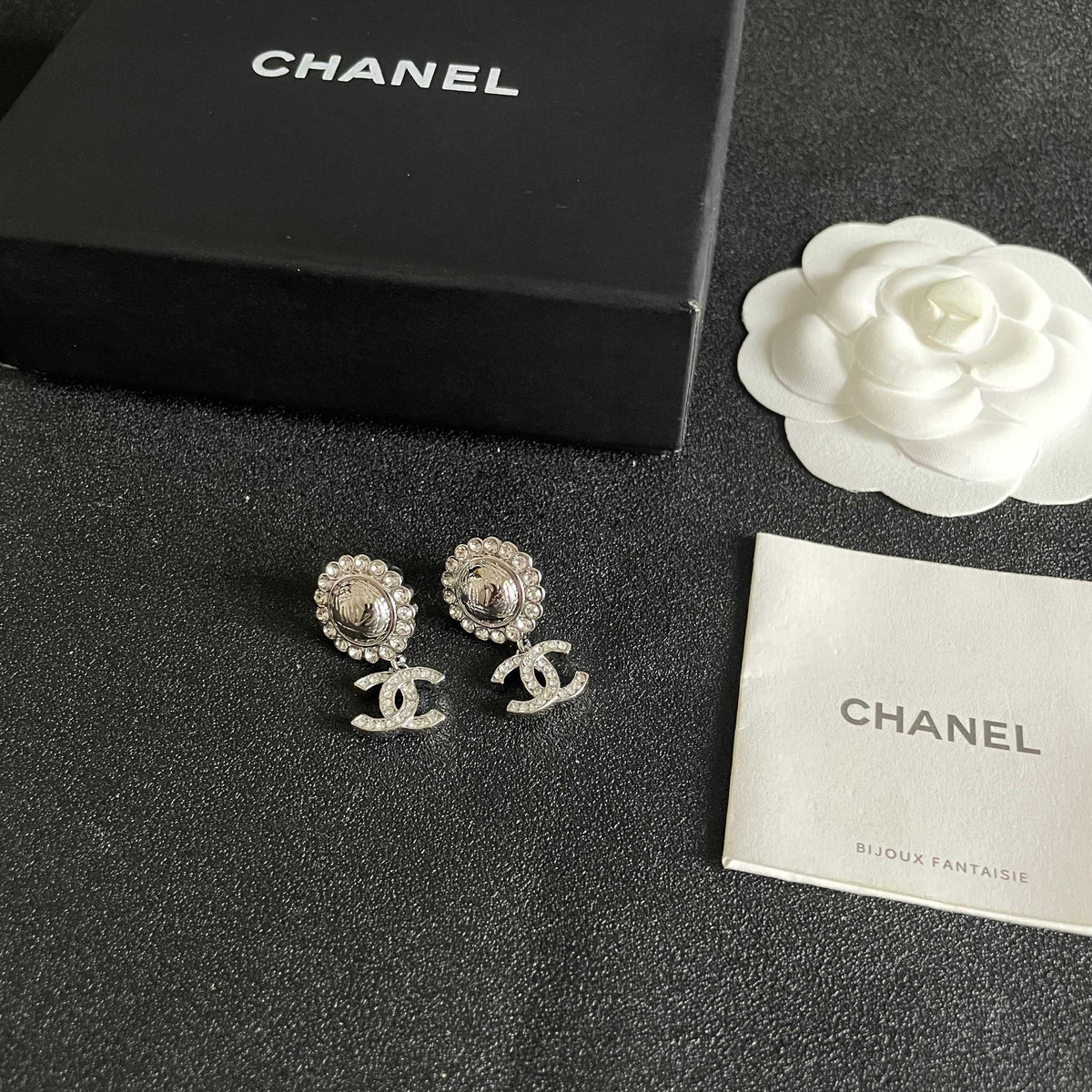 Martin Graham stud earrings in polished metal-tone – close-up detail