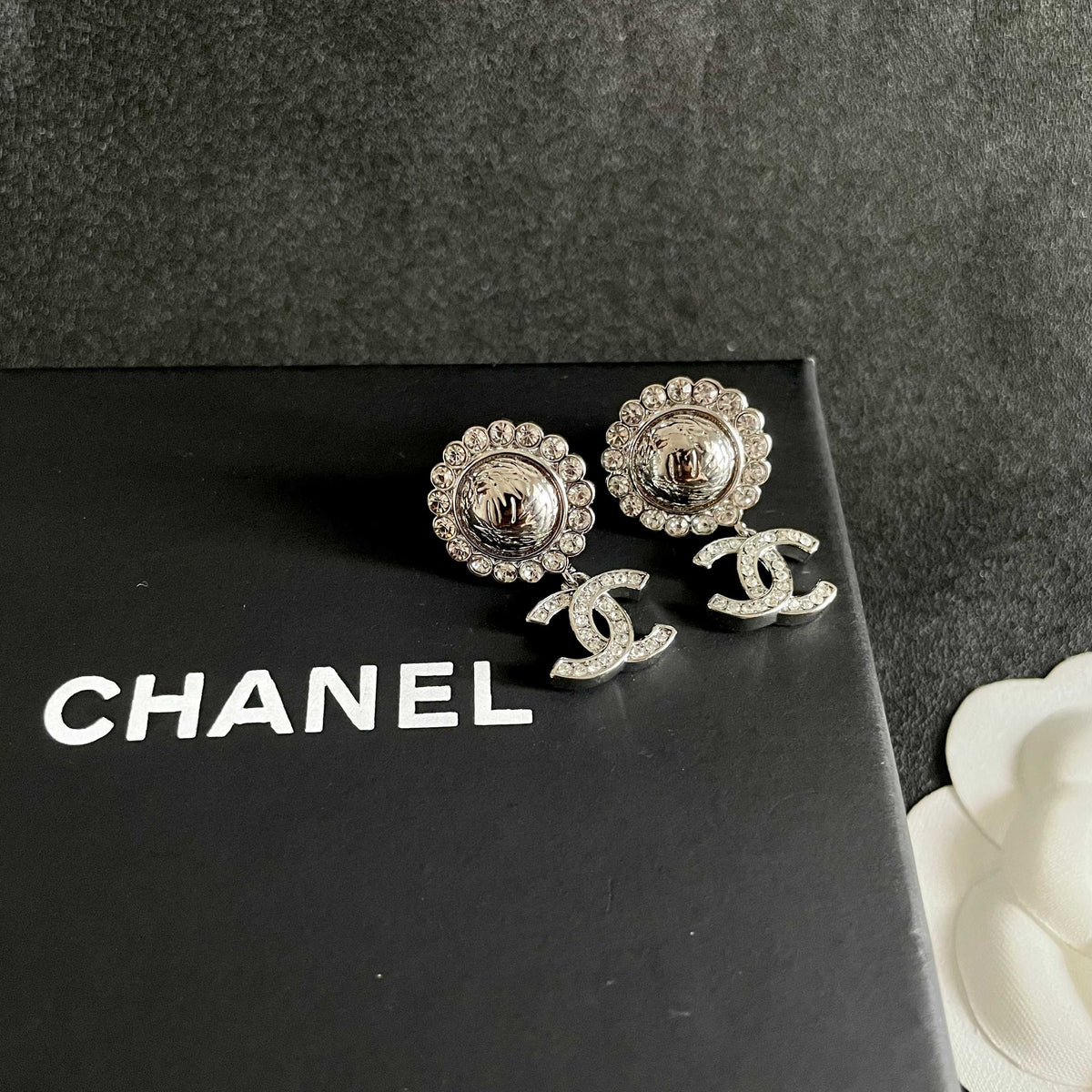 Martin Graham stud earrings in polished metal-tone – detail view