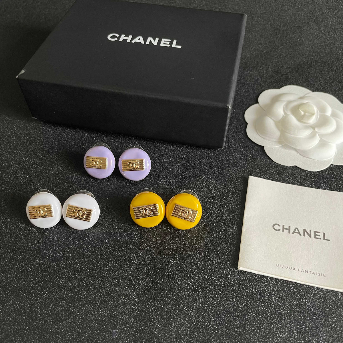 Martin Graham stud earrings in polished metal-tone – close-up detail